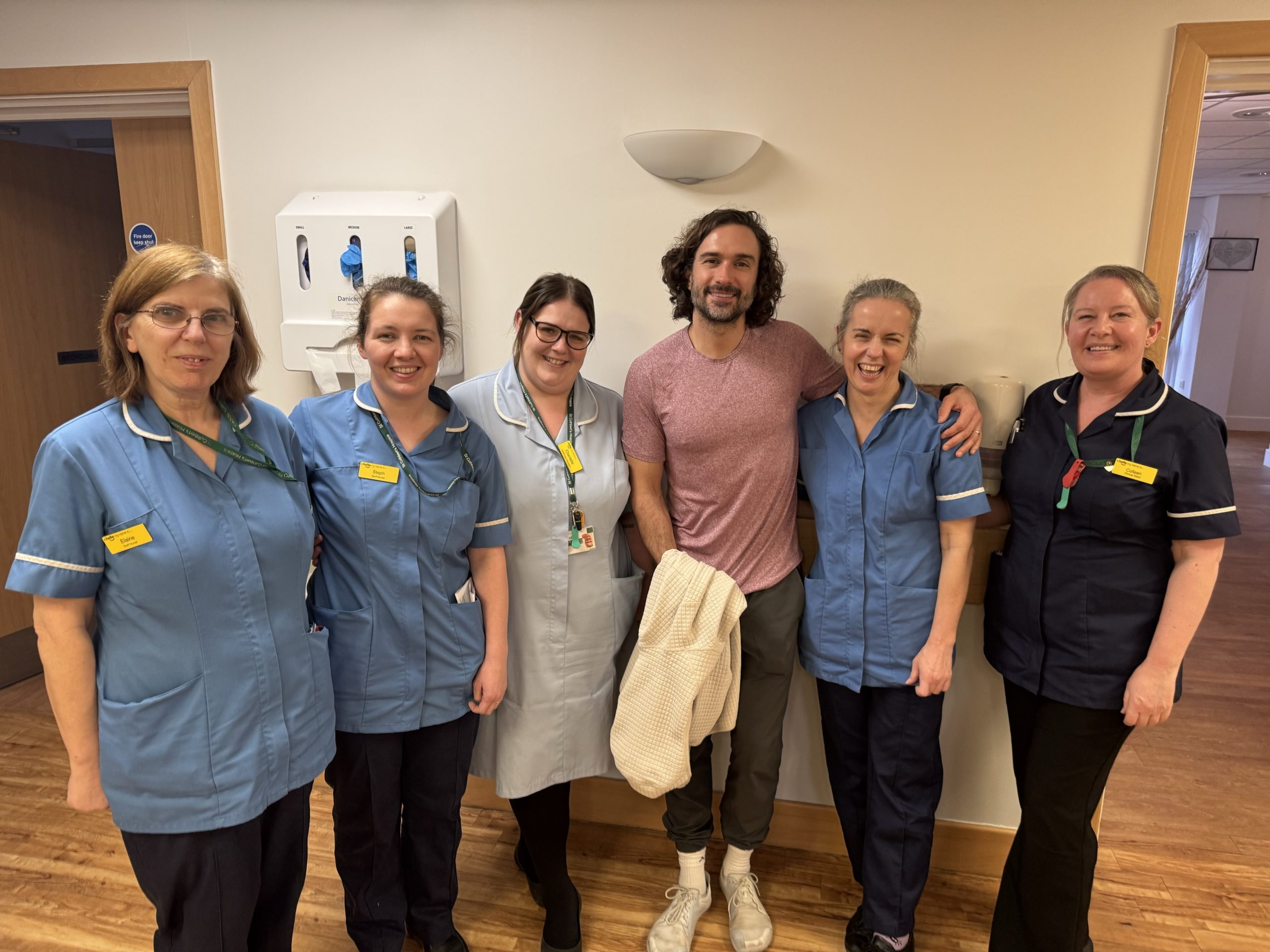 Nursing staff stand with Joe Wicks